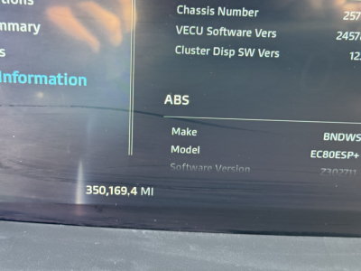 Vehicle information screen showing ABS, Make BNDWS, Model EC80ES+ with software versions and mileage 350,169.4 MI on Kenworth T680 dashboard