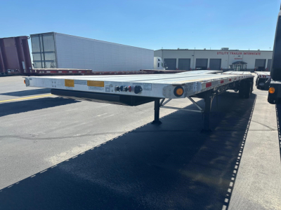 Utility spread air combo flatbed trailer showing rear, with lighting and reflectors.