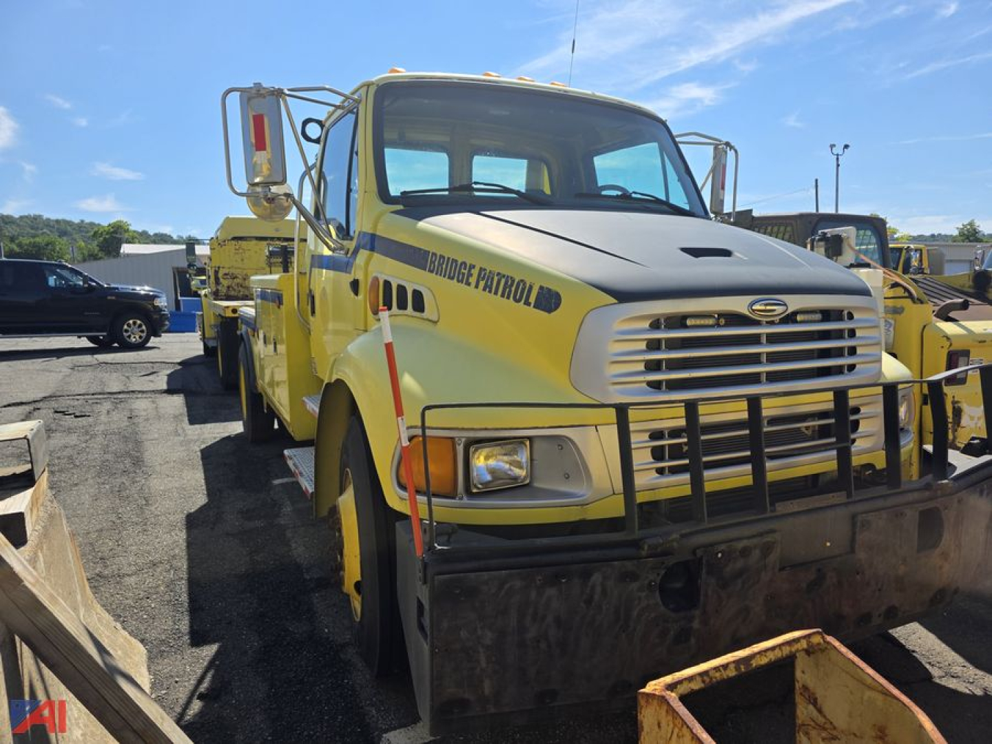 Tow truck with yellow Bridge Patrol wrecker body, front chrome grille, heavy plow guard, Sterling Acterra cab, side text 'Bridge Patrol'