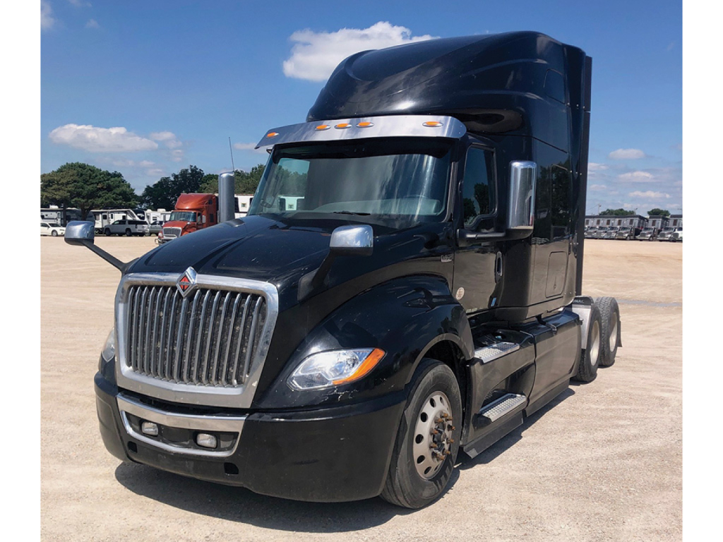 Truck shows a black 2020 International LT625 conventional sleepers, front three-quarter view with large chrome grille and sleeper cab, no visible decals.