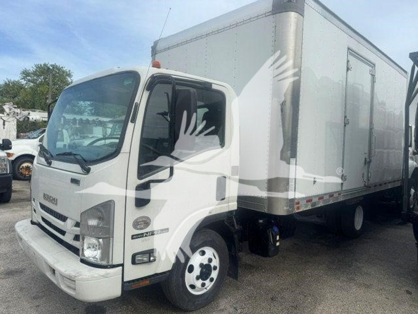 Isuzu NPR-HD box truck idle view showing cab and box with VIN JALC4W163M7005857 and stock T05857.