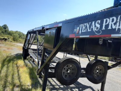 Trailer side showing 'TEXAS PRIDE' branding on a car carrier trailer with dual rear axles and utility boxes.