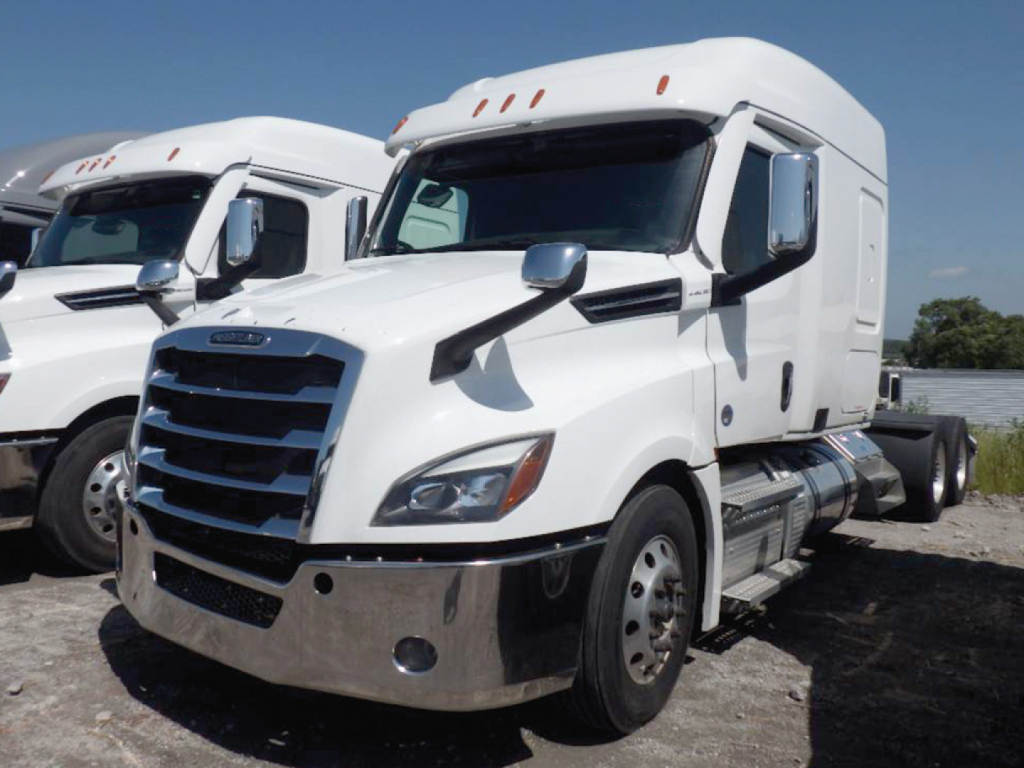 Truck cab front-left view of a white 2024 Freightliner Cascadia125/126 sleeper tractor with chrome bumper and black grille