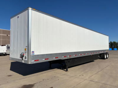 New white Utility 53' box trailer with dual rear axles and landing gear, side reflectors, and small brand sticker near front corner.