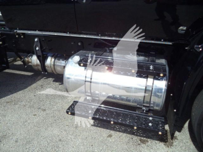 Truck fuel tank and side step shown on International MV chassis with reflection on chrome tank