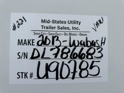 Label on trailer showing Mid-States Utility Trailer Sales, Inc. handwritten VIN and stock numbers: S/N DL2816683, STK # U90785, Make 2013-Wabash,  VAN trailer.