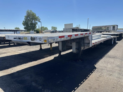 2014 Reitnouer 48' all-aluminum drop deck trailer with two tool boxes and four ramps, visible undercarriage and reflective safety tape along sides.