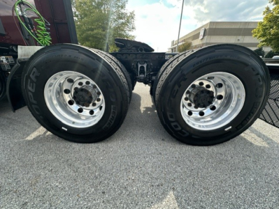 Kenworth T680 rear dual tires on axle showing wheel rims and tire branding.