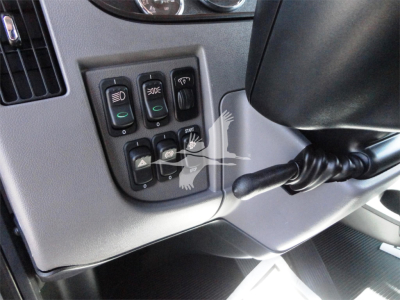 Peterbilt 337 dashboard controls panel with multiple switches and stalk, close view of operation levers and climate controls.