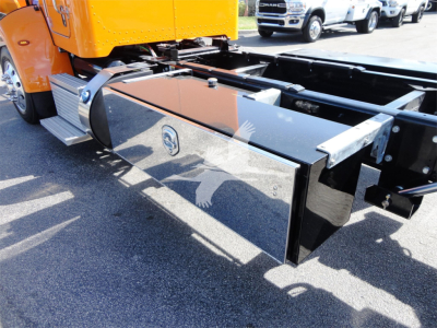 Truck chassis side with shiny toolbox/compartment and fuel tank, Peterbilt 337 rollback bed visible.