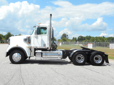 2019 Freightliner 122SD truck side view showing chassis and cab with chrome exhaust stack.