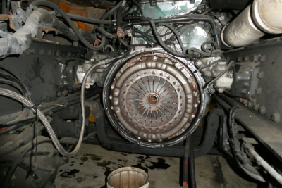 Volvo VNM42T engine bay showing clutch housing and surrounding wiring and components.