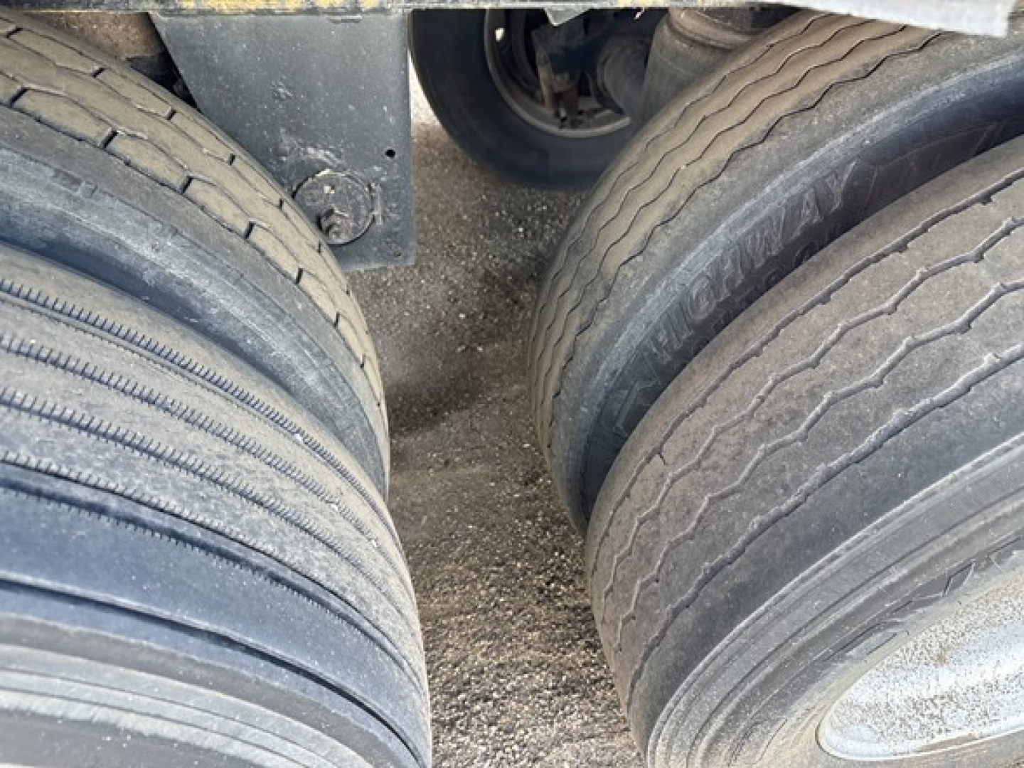 Trailer tires and undercarriage view for a 2015 Merritt Heritage hopper trailer.