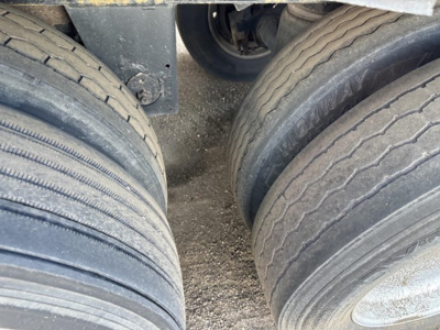 Trailer tires and undercarriage view for a 2015 Merritt Heritage hopper trailer.