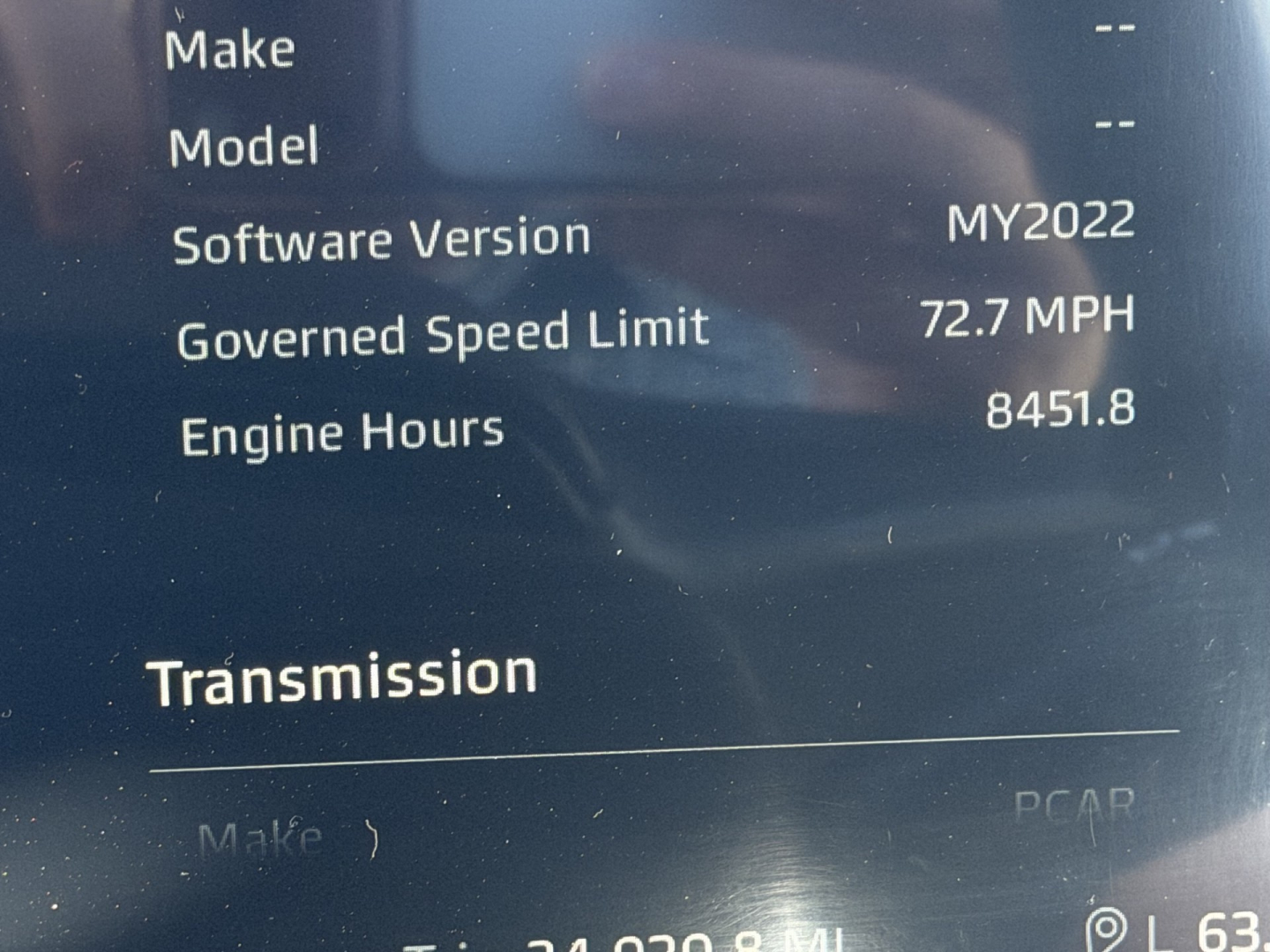 Vehicle display showing Software Version MY2022, Governed Speed Limit 72.7 MPH, Engine Hours 8451.8, Transmission label.