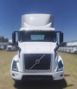 Volvo VNR64T300 conventional daycab truck front view showing grille, headlights, and bumper.