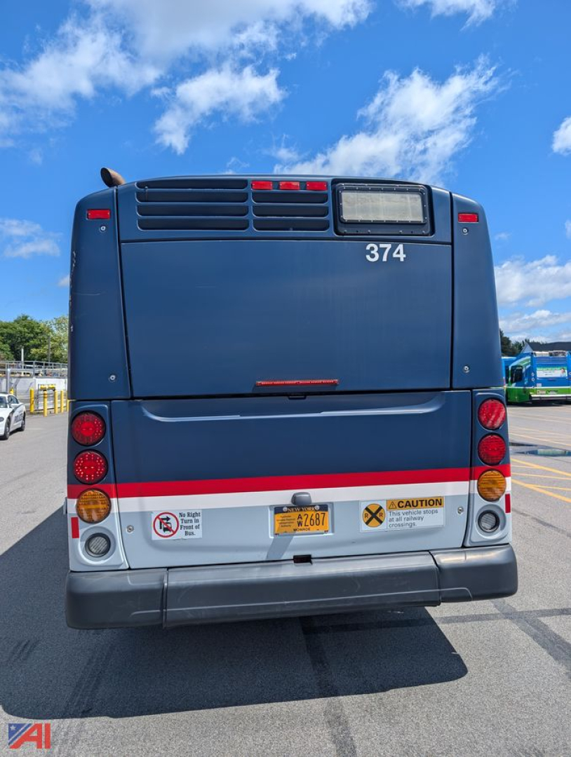 Rear view of a blue 2013 New Flyer XD60 transit bus showing rear bumper, taillights, and numbered 374 with caution stickers.