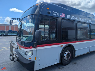Bus front-left view of a 2013 New Flyer XD60 transit bus showing Regional Transit Service branding, number 374, and safety mirrors.