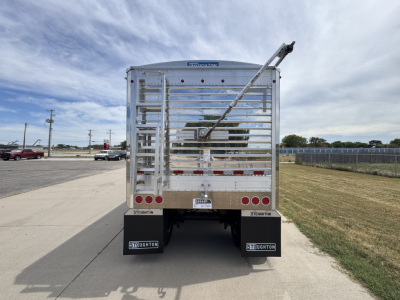 Trailer rear view of a new 2027 Stoughton 42' aluminum grain hopper with corrugated 74 inch sidewalls, polished metal exterior, and rear gates.
