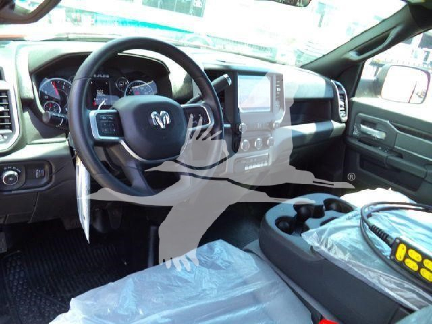 Ram 4500 interior showing steering wheel and center console with dashboard controls