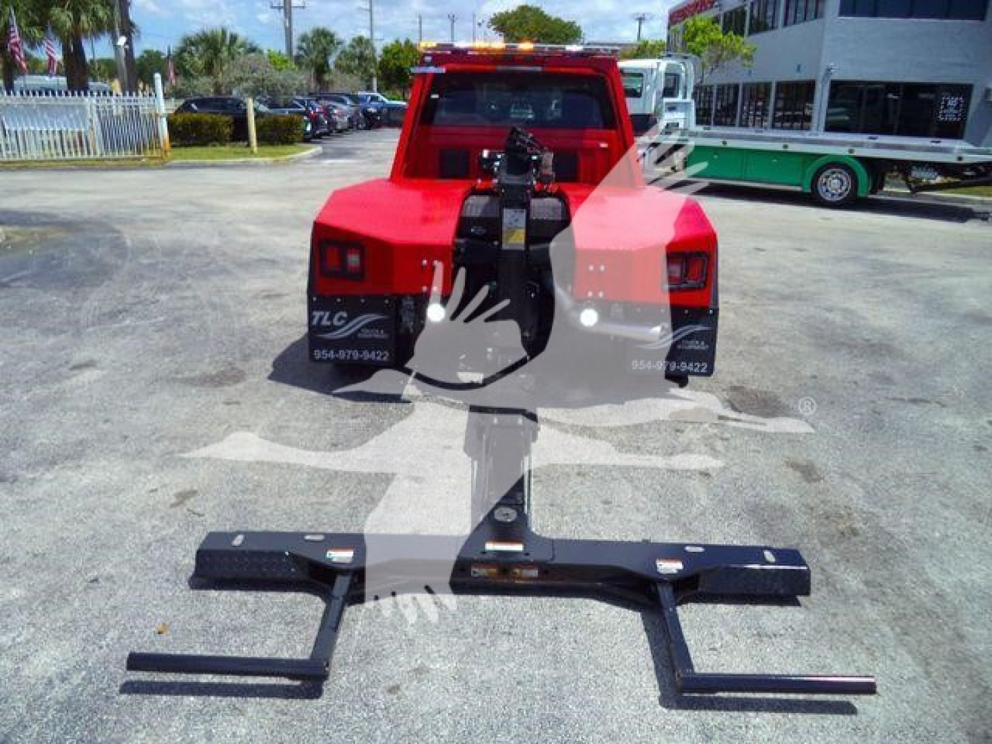 Ram 4500 SLT rear view showing winch hitch and heavy-duty tow bar assembly in driveway