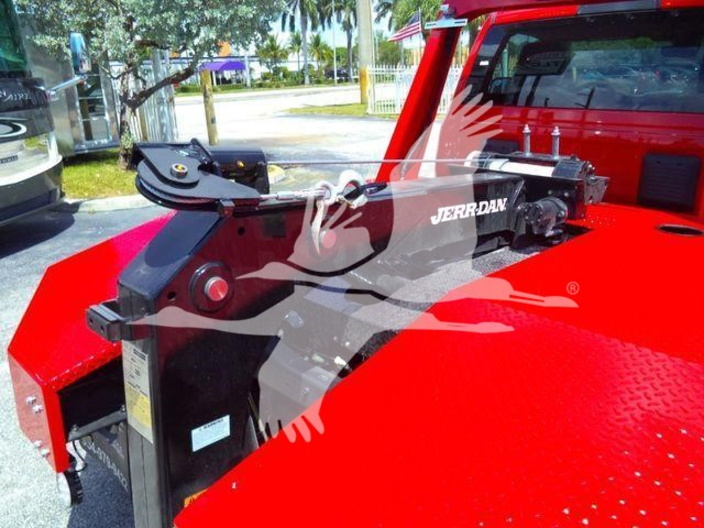 Ram 4500 truck bed showing a Jerrdan winch mounted on a red truck.