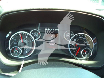 Ram dashboard showing instrument cluster with loading screen and RAM logo overlay.