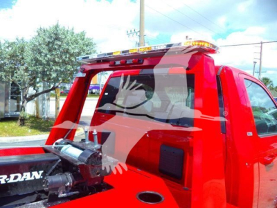 Ram 4500 SLT pickup truck in red with a winch, side view showing rear cab and bed area