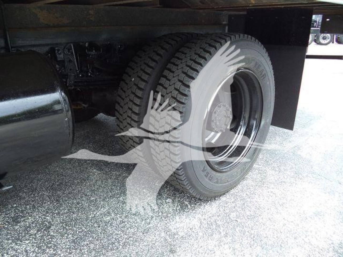 Rear wheel and undercarriage of a 2020 Hino 195 refrigerated truck showing tire, wheel, and part of the frame.