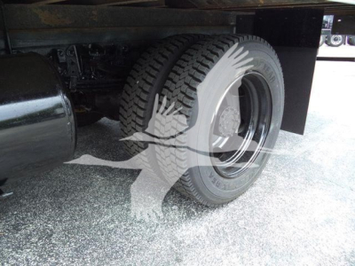 Rear wheel and undercarriage of a 2020 Hino 195 refrigerated truck showing tire, wheel, and part of the frame.