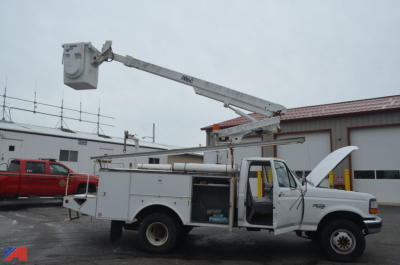 Bucket truck on a service body showing elevated hydraulic boom with bucket; front cab door open; utility compartments visible on side; Ford F-450 Super Duty bucket truck.