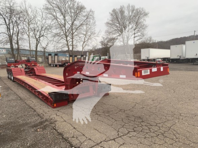 Fontaine 55Lcc lowboy trailer with extended neck and dual rear axles in red, aluminum deck, parked in lot.