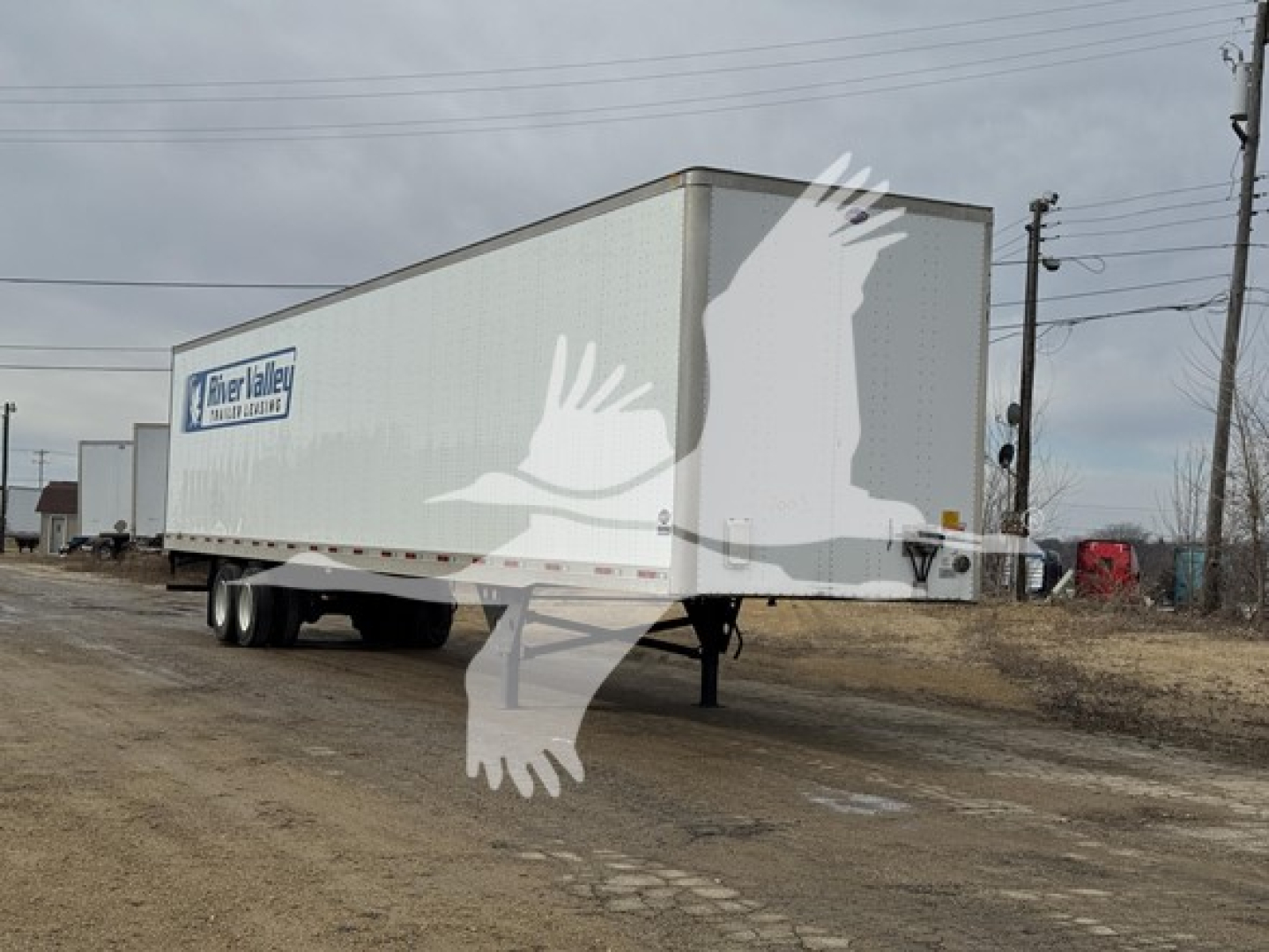 Utility dry van trailer showing Weathered side with Silver Valley logo and dual-axle wheels, dirt lot, overcast sky