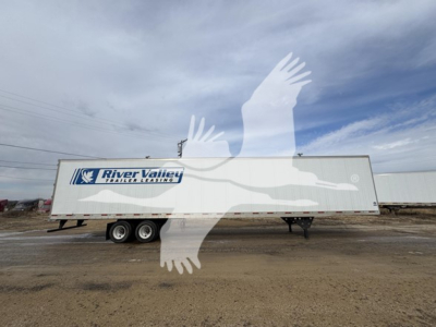Trailer side showing River Valley trailer leasing logo on dry van with two axles and desert background.