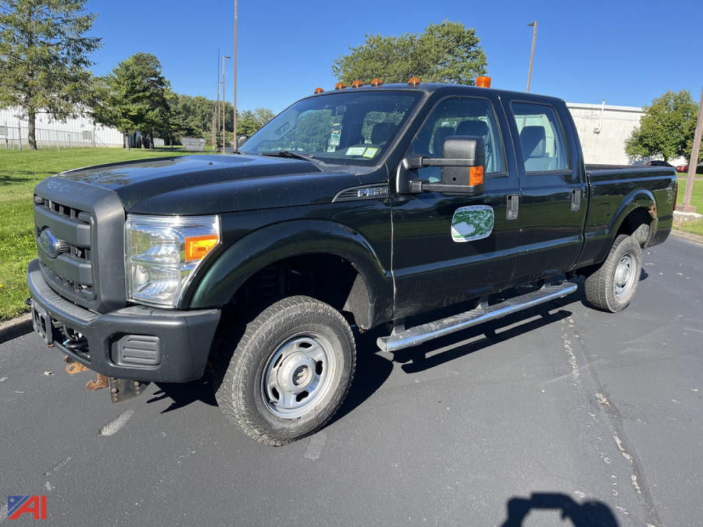 Ford F-350 Super Duty pickup truck in black, extended cab, dual rear wheels, with orange cab lights and side steps.
