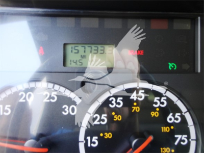 Dashboard view of a 2014 Freightliner M2 106 showing the odometer reading 157,333 miles and a speedometer with mph markings.
