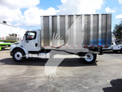 Freightliner M2 106 dump truck side view showing cargo bed and chassis