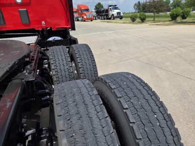 Kenworth T680 chassis and dual rear tires view showing wheel tread and frame.