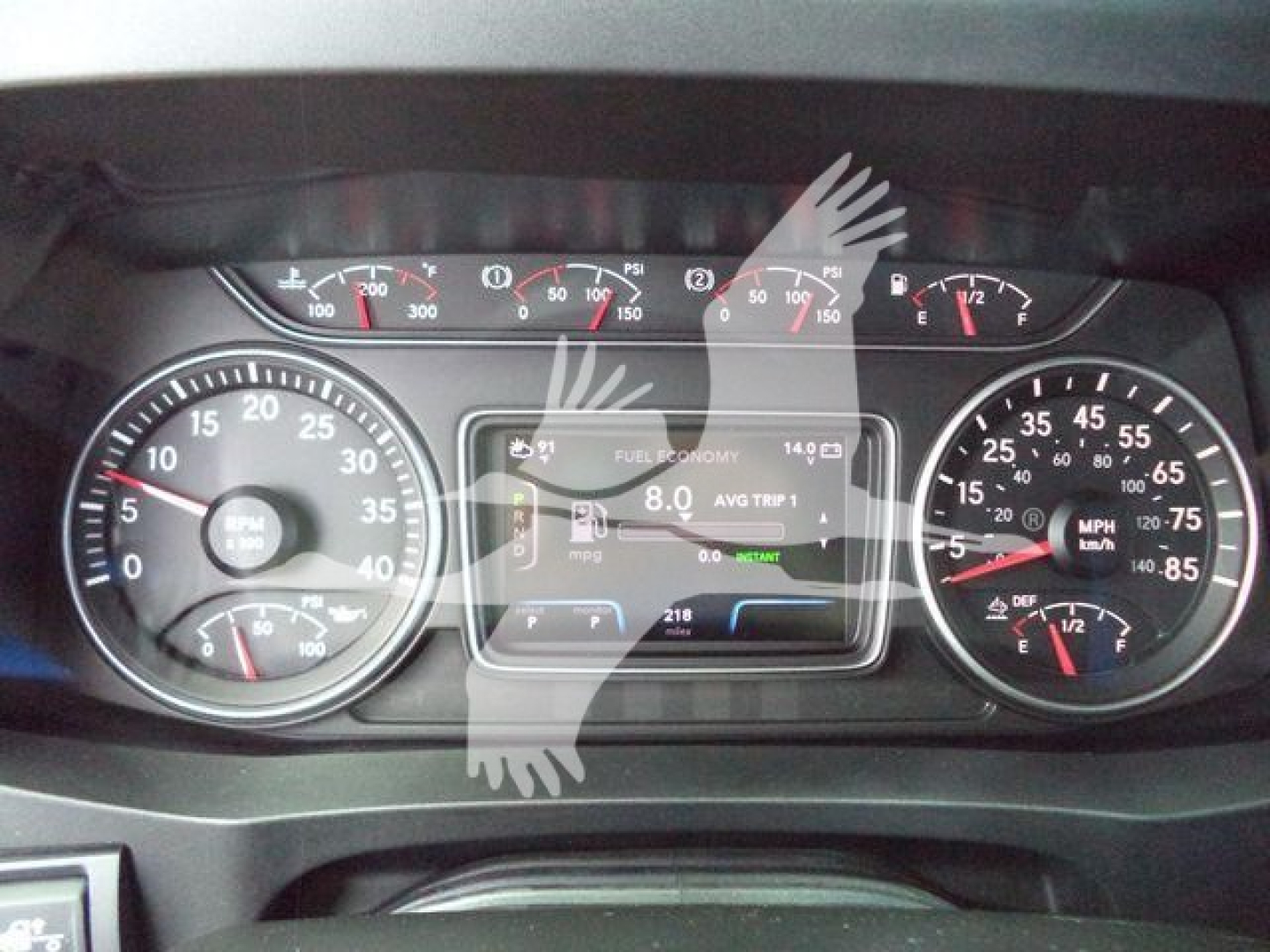 Dashboard of a 2027 International MV truck showing instrument cluster and center display. Visible text includes fuel economy, AVG TRIP, and MPG gauges.