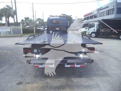 Flatbed tow truck bed with rear platform and lights, viewed from the back.