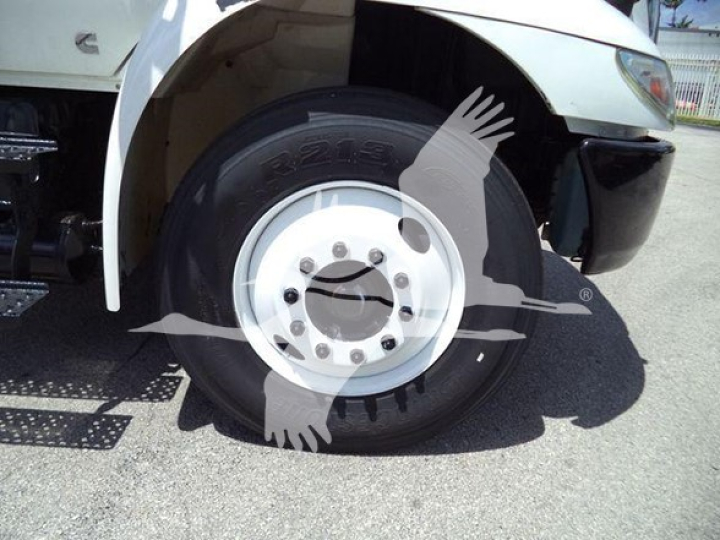 2019 International Durastar 4300 wheel well and front tire close-up showing wheel hub and fender area.