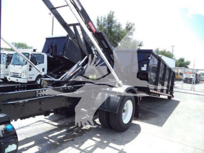 Truck body showing Durastar 4300 roll-off truck with hydraulic crane and dump trailer in a dealership lot.