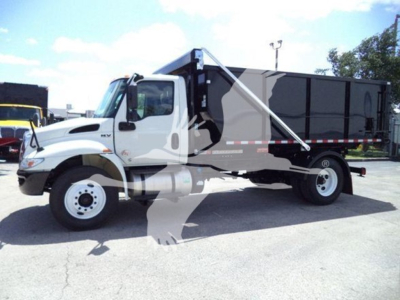 2019 International Durastar 4300 roll-off truck in side view with cab and dumping container. Visible text includes model 4300 badge and International logo.