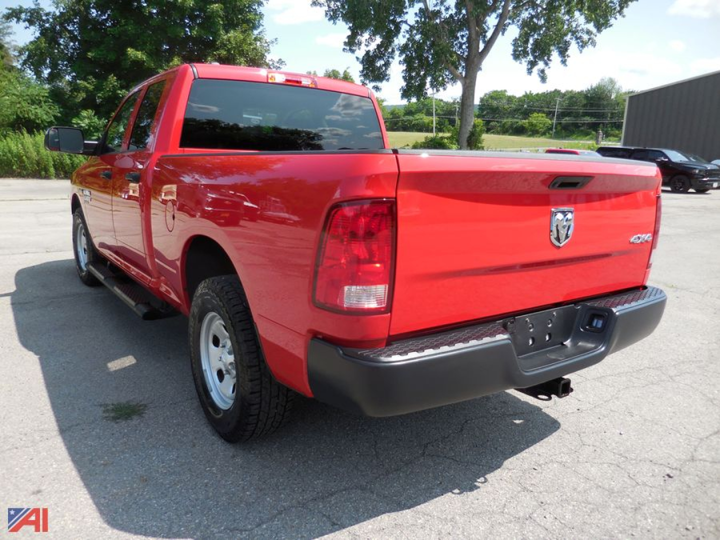 Ram 1500 Classic Tradesman quad cab pickup truck rear view showing bed and tailgate.