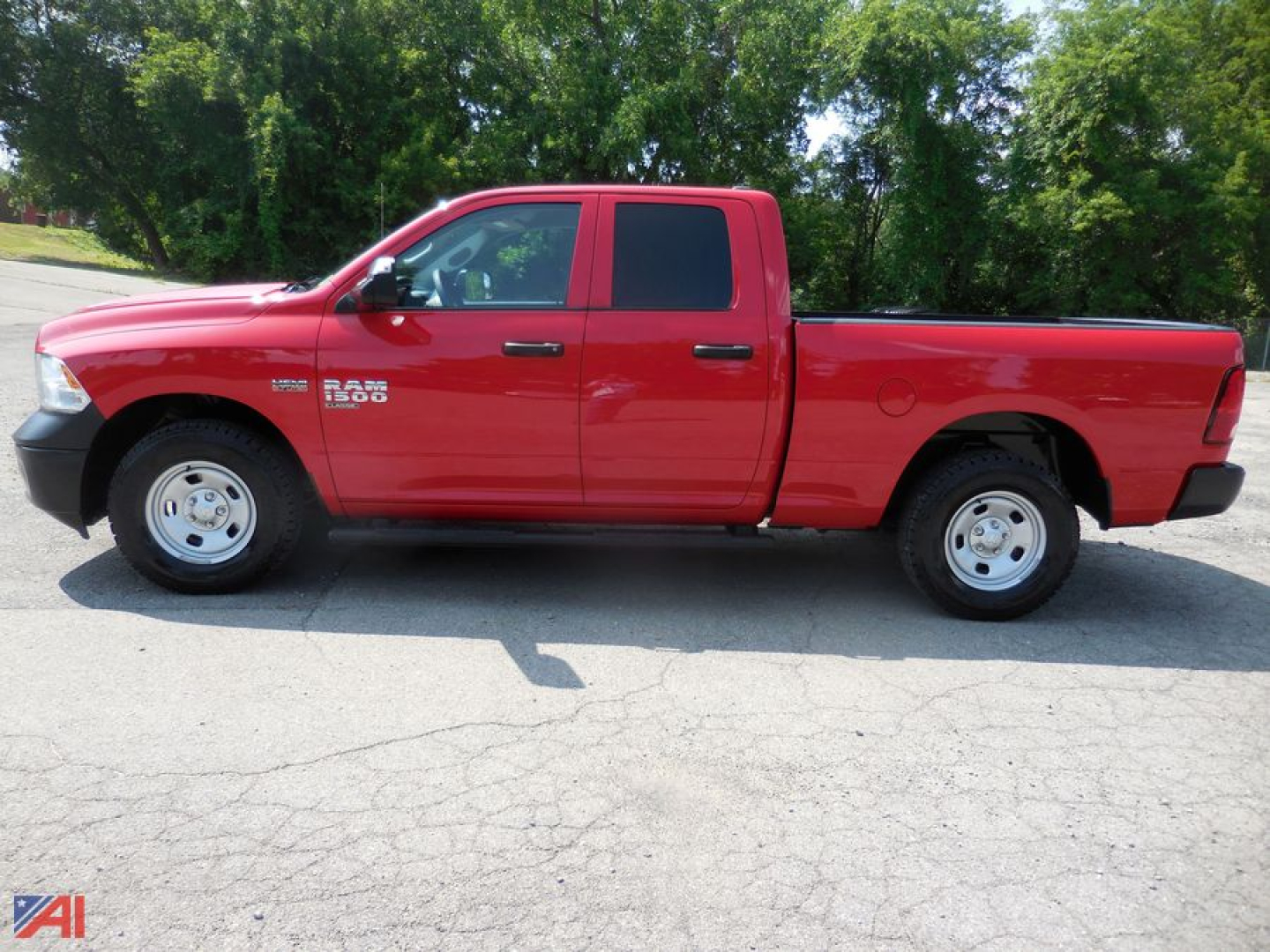 Ram 1500 pickup truck side view showing Crew Cab with Quad Doors red exterior, dual front doors, long bed, RAM 1500 badge on front fender.