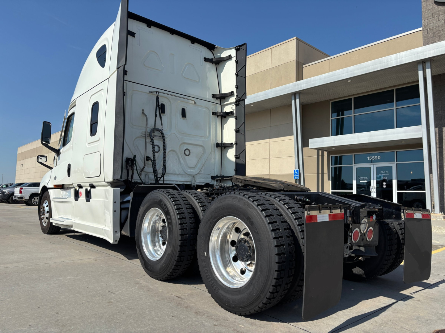 Freightliner PT126064ST tractor rear view showing dual rear wheels, fifth-wheel area, and back of sleeper cab.