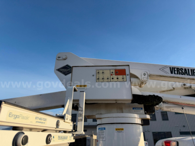 Ford bucket truck boom and base showing Versalift equipment label and control panel