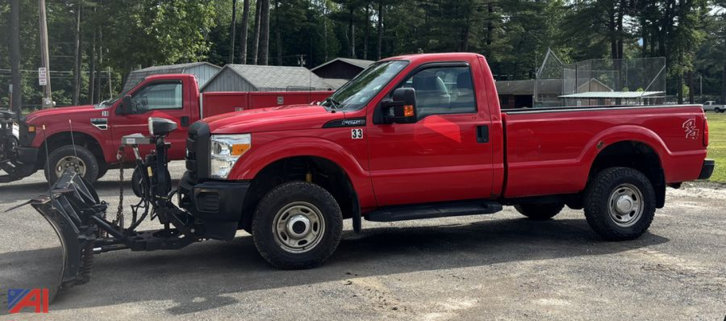 Ford F-250 Super Duty pickup with plow in front, red long-bed truck, single cab, 4x4 stance, outdoor lot.