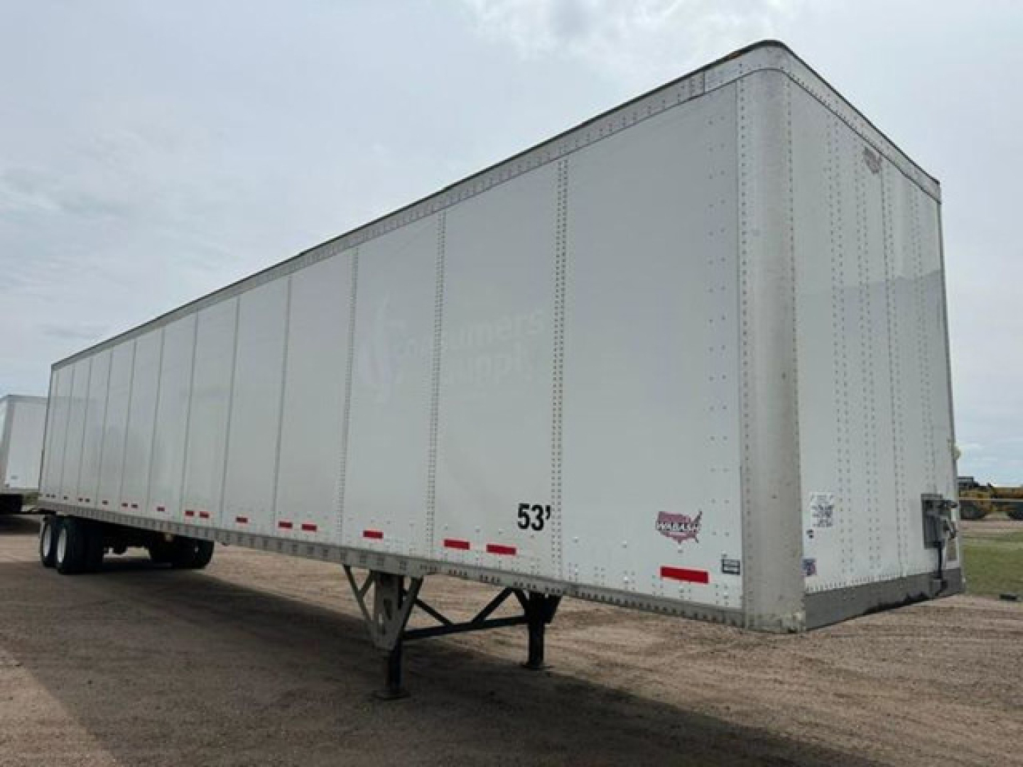 Wabash 53' enclosed trailer side view showing stake pocket profiles and front nose; VIN 1JJV532D9GL908651 visible in listing.