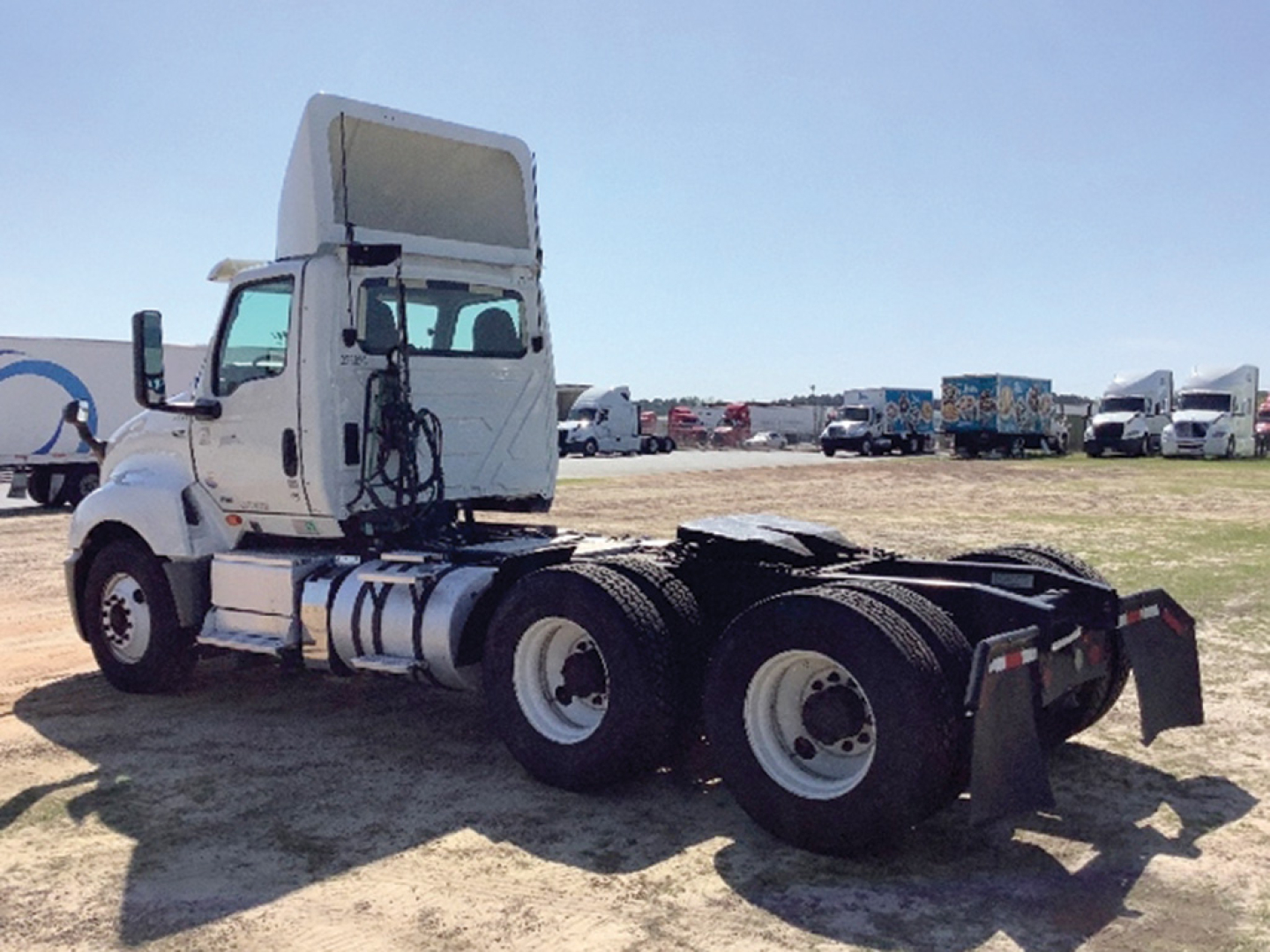 2019 International LT625 truck cab with rear dual-axle setup and fifth-wheel area visible